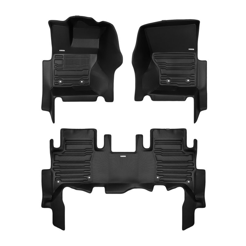 A set of black TuxMat car floor mats for Land Rover Discovery models.