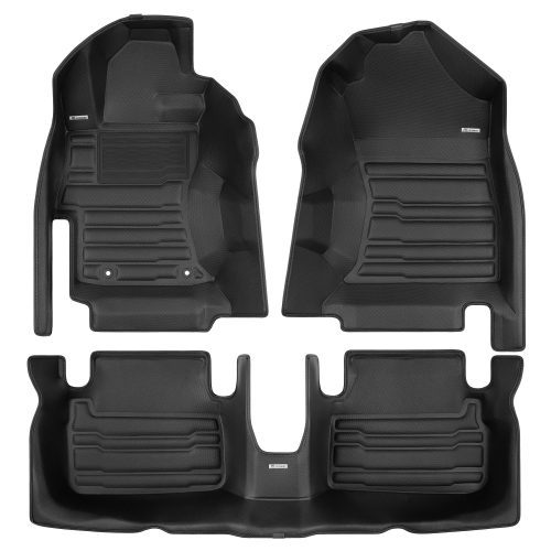 A set of black TuxMat car floor mats for Subaru Impreza models.