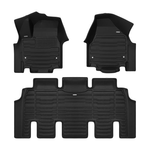 A set of black TuxMat car floor mats for Chrysler Grand Caravan models.