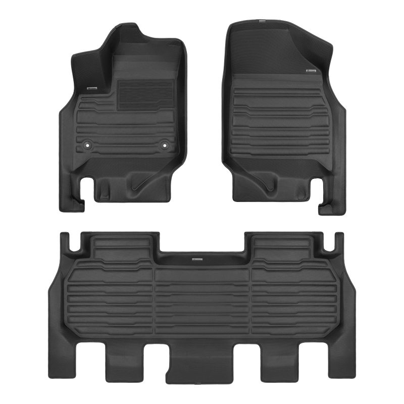 A set of black TuxMat car floor mats for Chevrolet Traverse models.