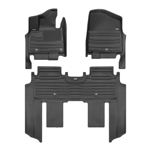 A set of black TuxMat car floor mats for Kia Carnival models.