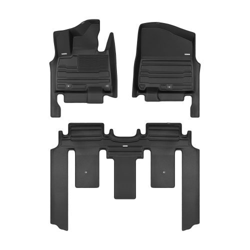 A set of black TuxMat car floor mats for Kia Carnival models.