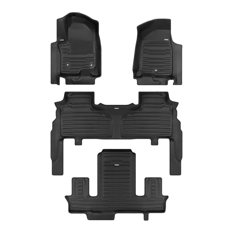 A set of black TuxMat car floor mats for Cadillac Escalade models.