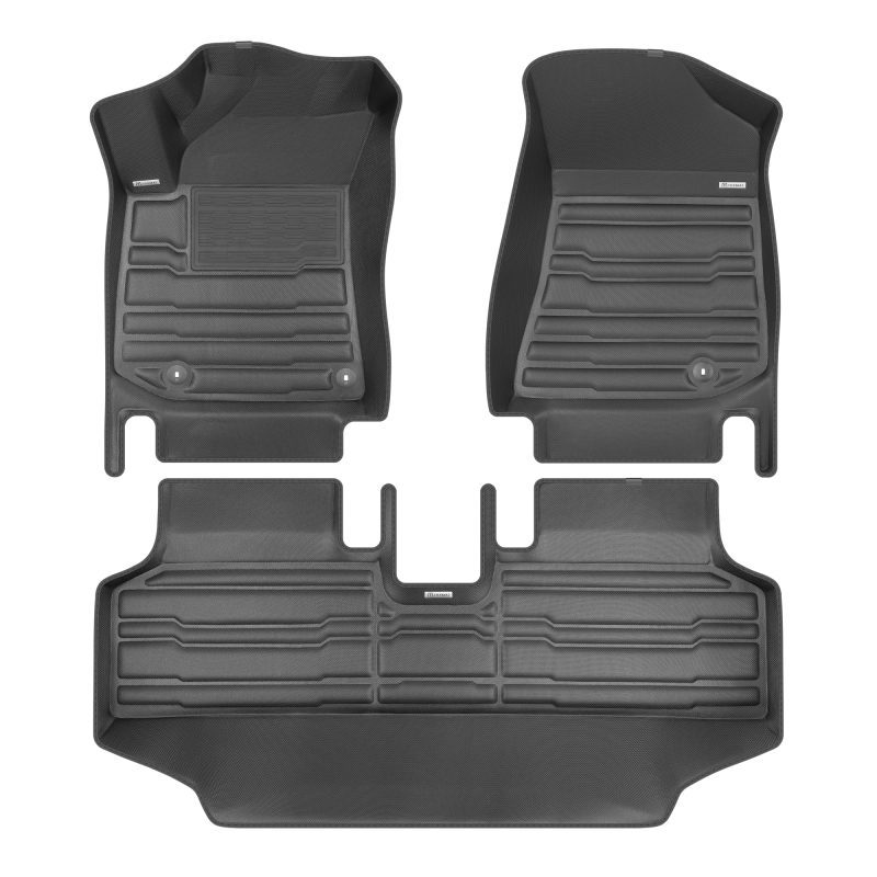 A set of black TuxMat car floor mats for Kia Niro models.