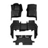 A set of black TuxMat car floor mats for Land Rover Defender models.