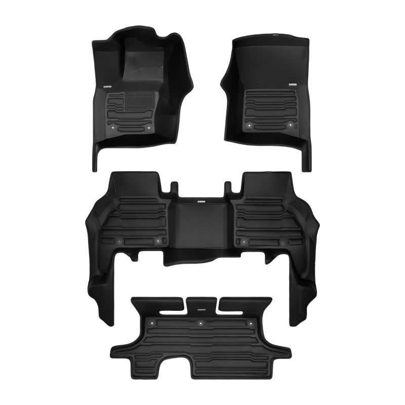 A set of black TuxMat car floor mats for Land Rover Defender models.